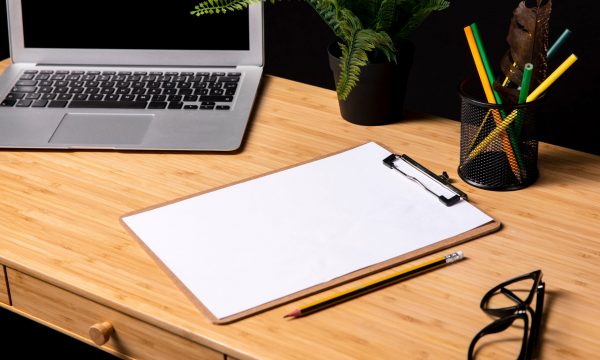 tidy-desk-with-clipboard-glasses